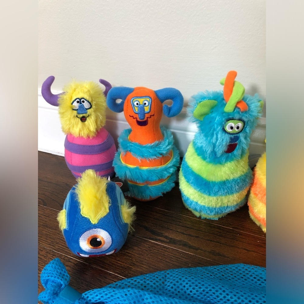 Melissa & Doug 8-Piece Fuzzy Monster Bowling Pin and Ball Set w/Mesh Storage Bag - Picture 2 of 6